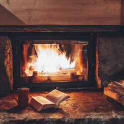 Open,Book,By,The,Fireplace,With,Christmas,Ornaments.,Open,Storybook