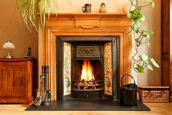 Cosy,Winter,Living,Room,Fireplace,,With,Open,Fire,With,Real
