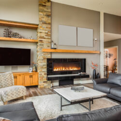 Furnished,Living,Room,In,Luxury,Home,With,Roaring,Fireplace